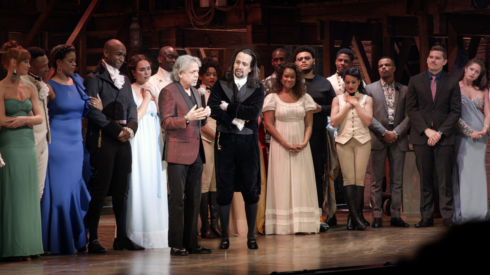 Luis Miranda (center left), on stage with his son Lin-Manuel Miranda (center right) after Hamilton debuted in Puerto Rico