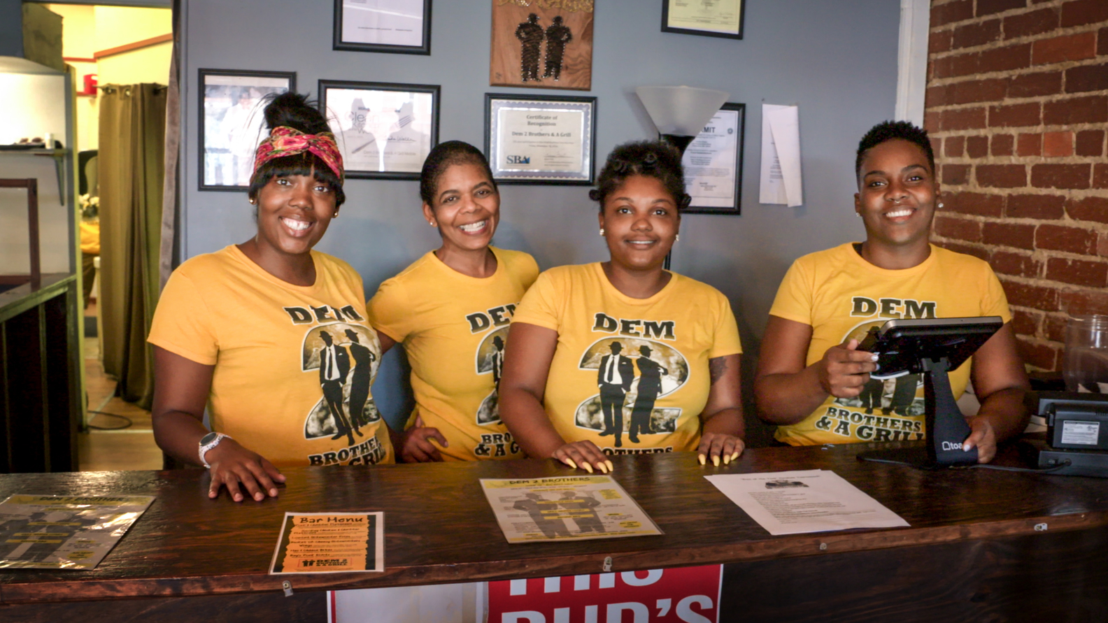 Workers at Adrian Wright’s Dem 2 Brothers & A Grill BBQ restaurant in Charleston, West Virginia