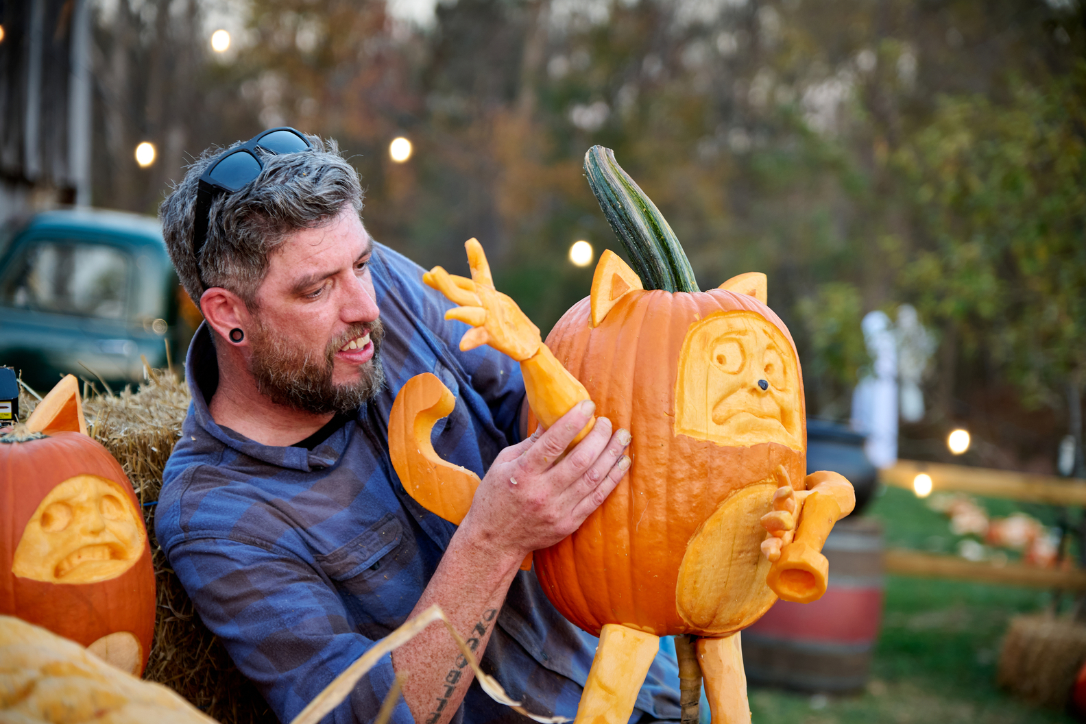 Outrageous Pumpkins - Contestant Titus Arensberg working on a creation