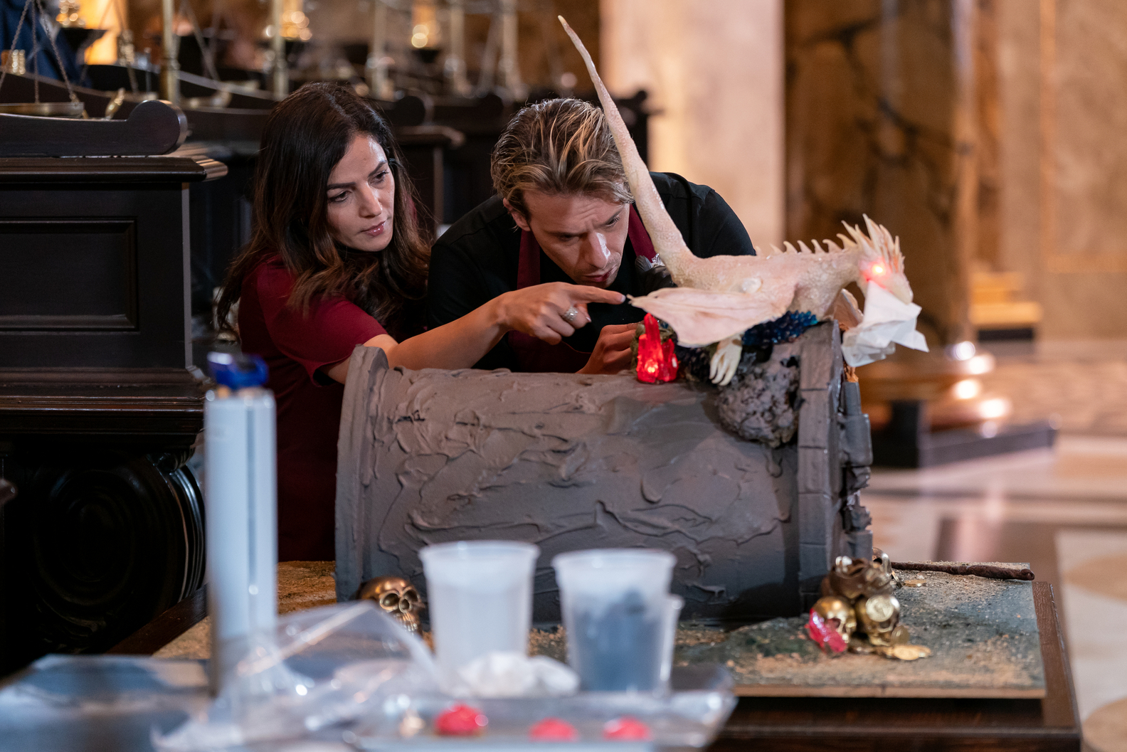 Competitors add final touches to their creation