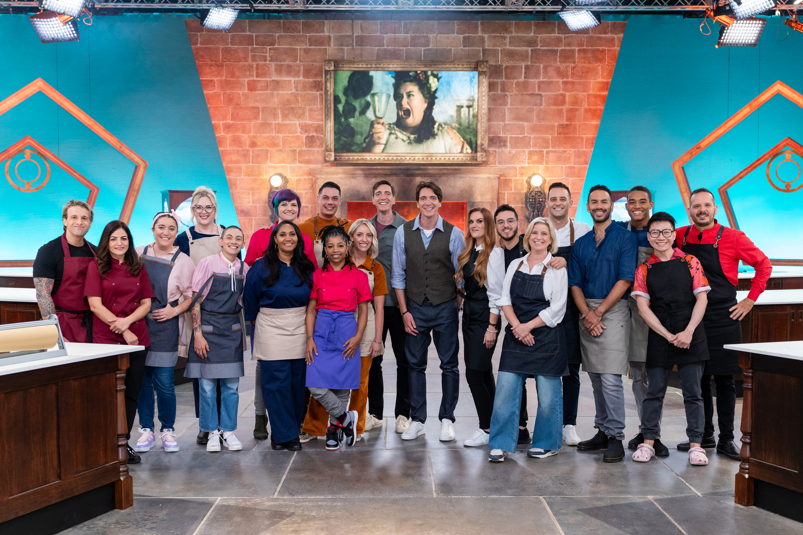 Hosts Oliver and James Phelps with the competitors on Food Network's Harry Potter Wizards of Baking