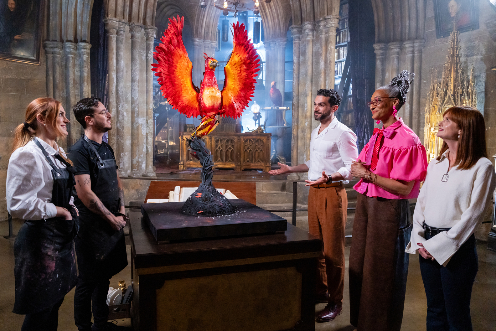 Judges Carla Hall, Jozef Youssef and special guest Bonnie Wright deliver feedback in Dumbledore's Office Food Network Harry potter Wizards of Baking