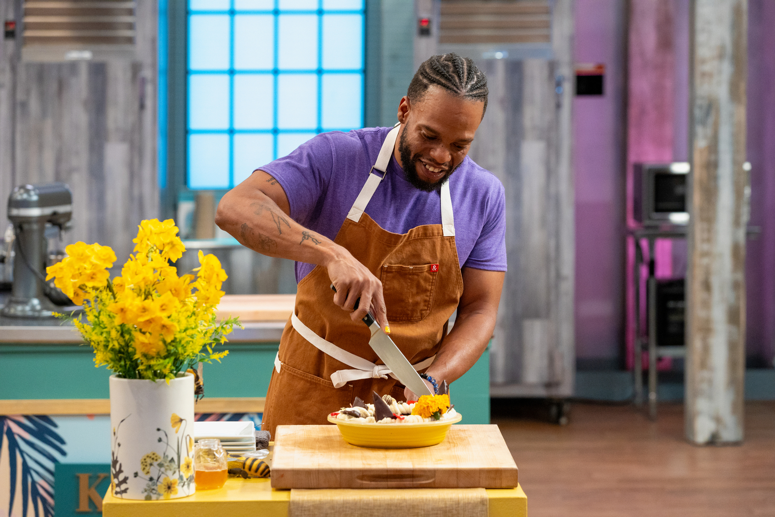 Contestant Kareem Youngblood cuts into his dish, Morning “Thyme” Cream and Coffee Pie with Chocolate Cookie Crust, Chocolate Covered Honey Candy, as seen on Food Network's Spring Baking Championship jpeg
