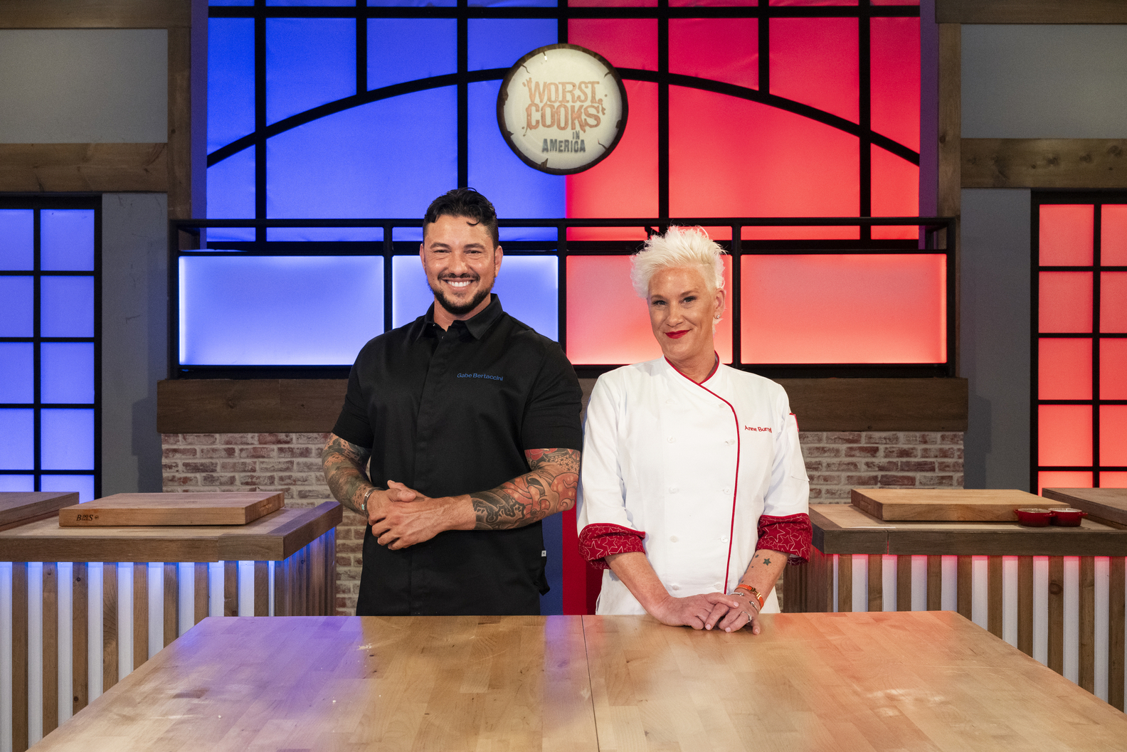 Hosts Anne Burrell and Gabe Bertaccini, as seen on Worst Cooks in America 