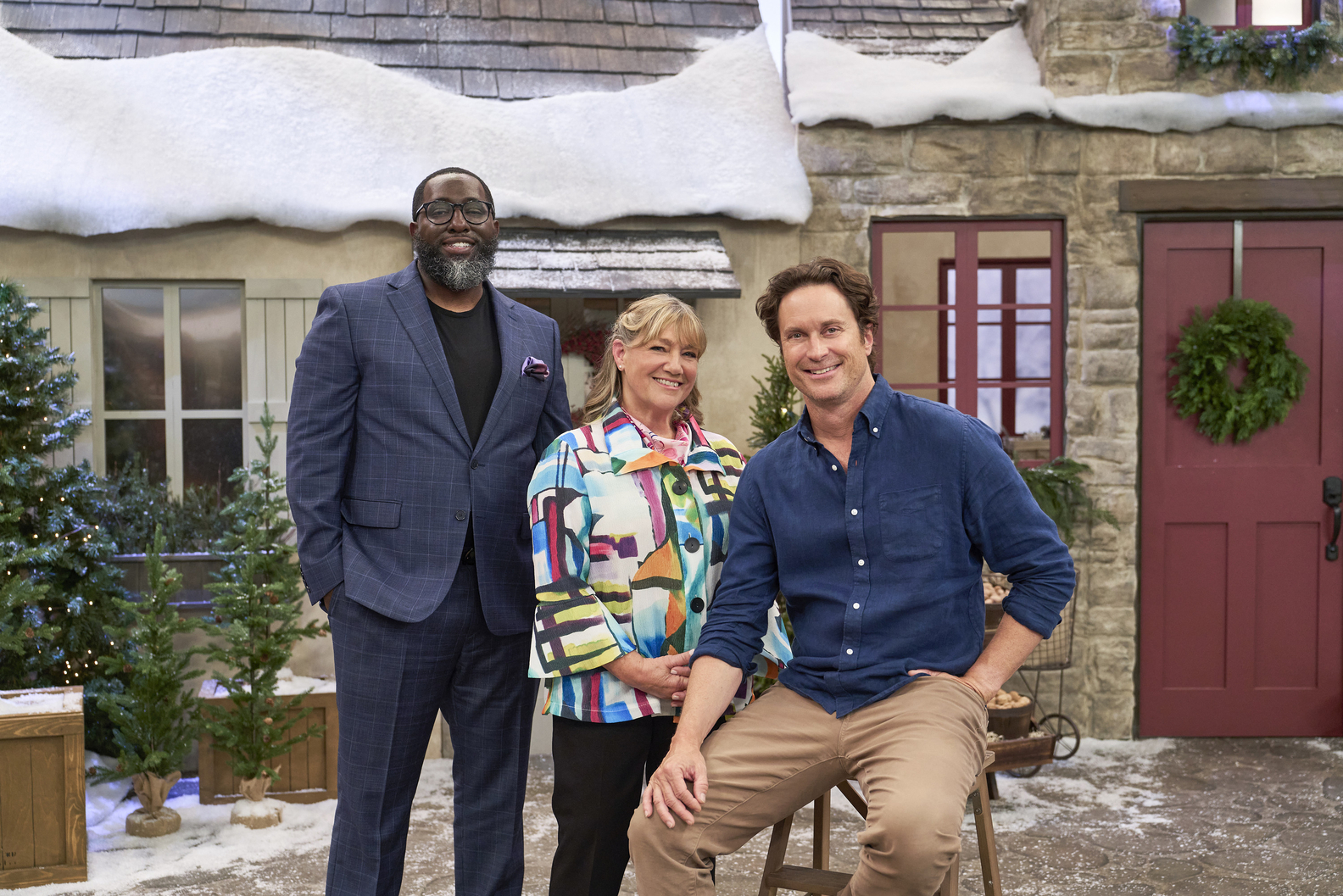 Gingerbread Land/ The Biggest Little Holiday Competition Judges Michael Ford and Gale Gand with Host Oliver Hudson. Courtesy of Magnolia Network