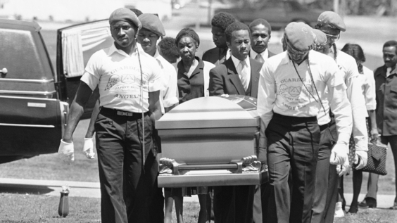 Casket containing Michael Cameron McIntosh, 23, the 25th victim in Atlanta’s string of slayings of young black is carried by members of the Guardian Angels and relatives during funeral services in Atlanta, April 27, 1981. 