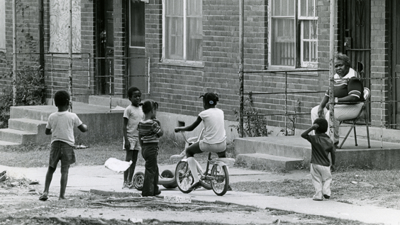 Children playing outside Capitol Homes Housing Project