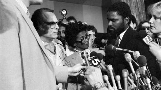 Wayne Williams defense attorneys Alvin Binder and Mary Welcome talk with reporters after the jury convicted Williams guilty of both murder charges (02/27/1982)