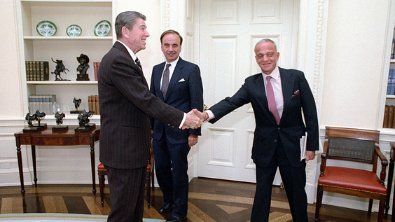 President Reagan shakes hands with Roy Cohn in the Oval Office (Jan. 18, 1983)