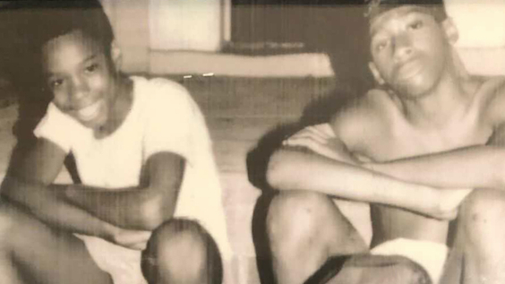 Brothers Freddy Hawkins, Amir Hawkins and Yusuf Hawkins with friend Christopher Graham sitting on the front stoop
