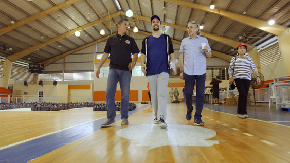 (center) Lin-Manuel Miranda with his father, Luis Miranda (right) and mother, Dr. Luz Towns-Miranda (far right) assisting with disaster relief efforts in Puerto Rico