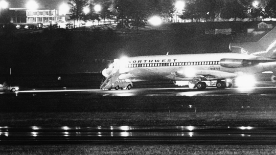 The hijacked Northwest Airlines jetliner 727 sits on a runway for refueling at Tacoma International Airport, Seattle, Washington (Nov. 25, 1971).