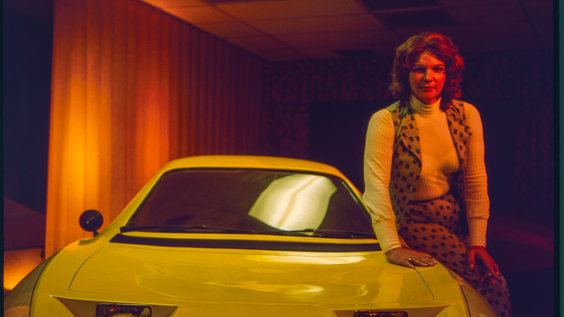 Elizabeth Carmichael posing next to the Dale automobile