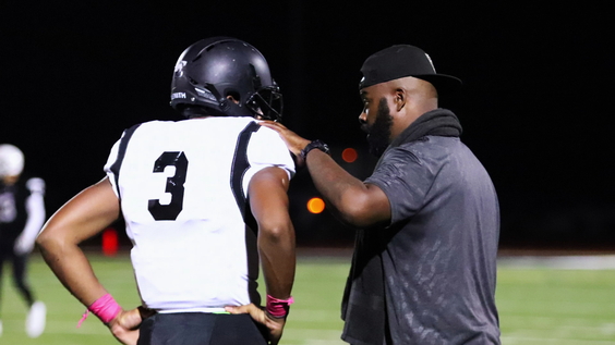 Roy Johnson (right) with a Bishop Sycamore player