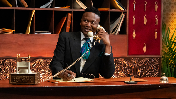 Host Titus Burgess in Food Network's Last Bite Hotel
