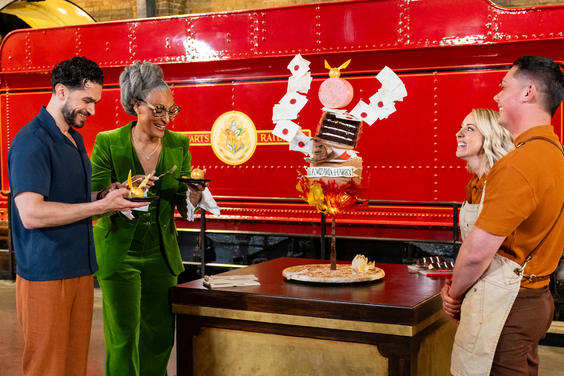Judges Jozef Youssef and Carla Hall check out a team's creation in front of Hogwarts Express