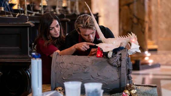 Competitors add final touches to their creation