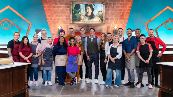 Hosts Oliver and James Phelps with the competitors on Food Network's Harry Potter Wizards of Baking