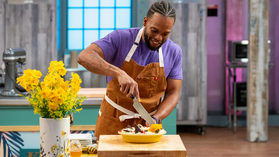 Contestant Kareem Youngblood cuts into his dish, Morning “Thyme” Cream and Coffee Pie with Chocolate Cookie Crust, Chocolate Covered Honey Candy, as seen on Food Network's Spring Baking Championship jpeg