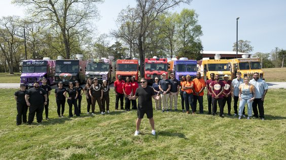 The Great Food Truck Race. Host Tyler Florence with the S19 competitors. Credit Food Network
