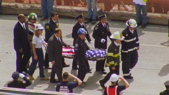 Rescue workers recovering a body from 9/11 Ground Zero