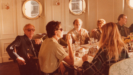 Robert Stigwood (left) at dinner aboard Jezebel yacht (1982)