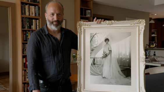 Anthony Fienberg with a photo of his mother, Joyce Fienberg, who was killed in the shooting at Tree of Life Synagogue