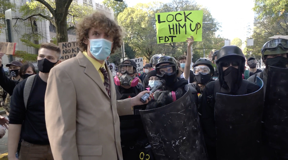 Andrew Callaghan and protesters in black bloc