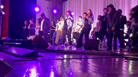 Students from Hill-Freedman World Academy High School performing