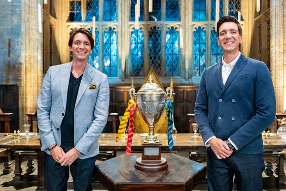 Hosts James and Oliver Phelps with the Wizards of Baking cup