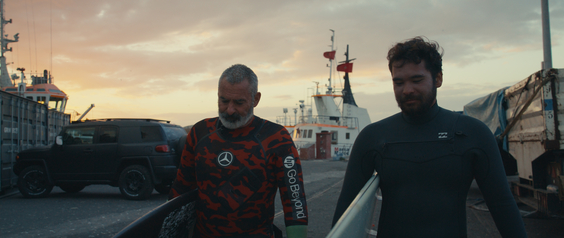 Garrett McNamara (left) with his son, Titus McNamara (right)