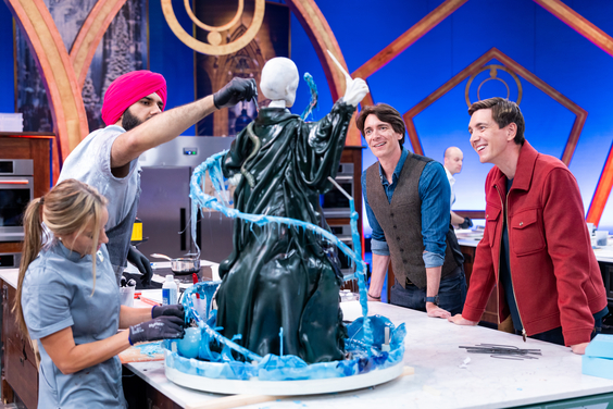 Hosts James and Oliver Phelps with competitors Katie Bonzer and Jujhar Mann on Food Network's Harry Potter Wizards of Baking