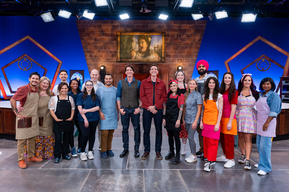 Hosts James Phelps and Oliver Phelps with the competitors on Food Network's Harry Potter Wizards of Baking Season 2