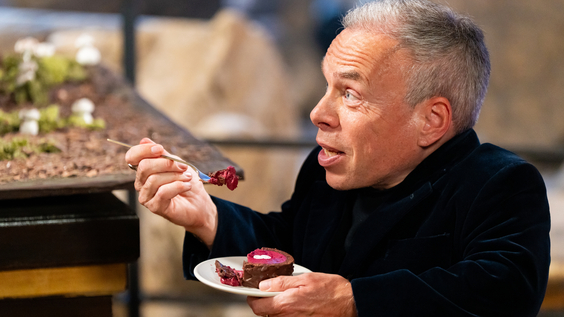 Guest Judge Warwick Davis tastes contestants creation