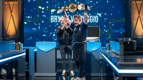 Host Guy Fieri and contestant Bryan Voltaggio reacts as he is announced the Tournament of Champions Season 7 winner